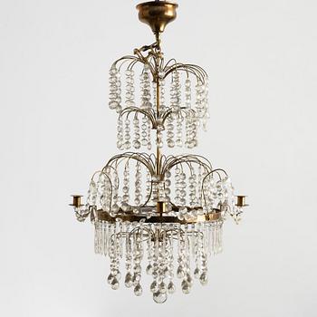 A four-light Gustavian-style chandelier, circa 1900.