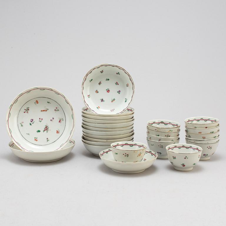 Eleven Chinese porcelian cups and saucers and two small dishes, circa 1800.