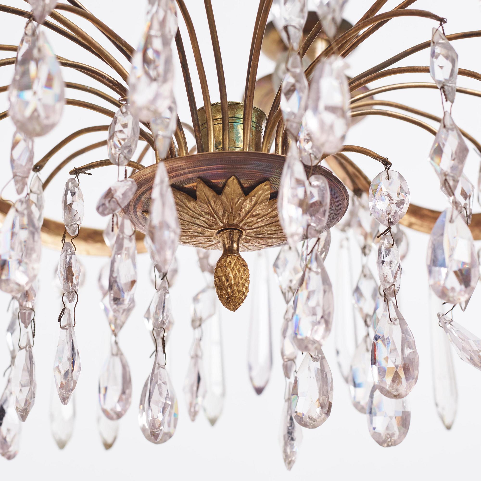 A Gustavian gilt brass and cut glass four-light chandelier, Stockholm, late 18th century.