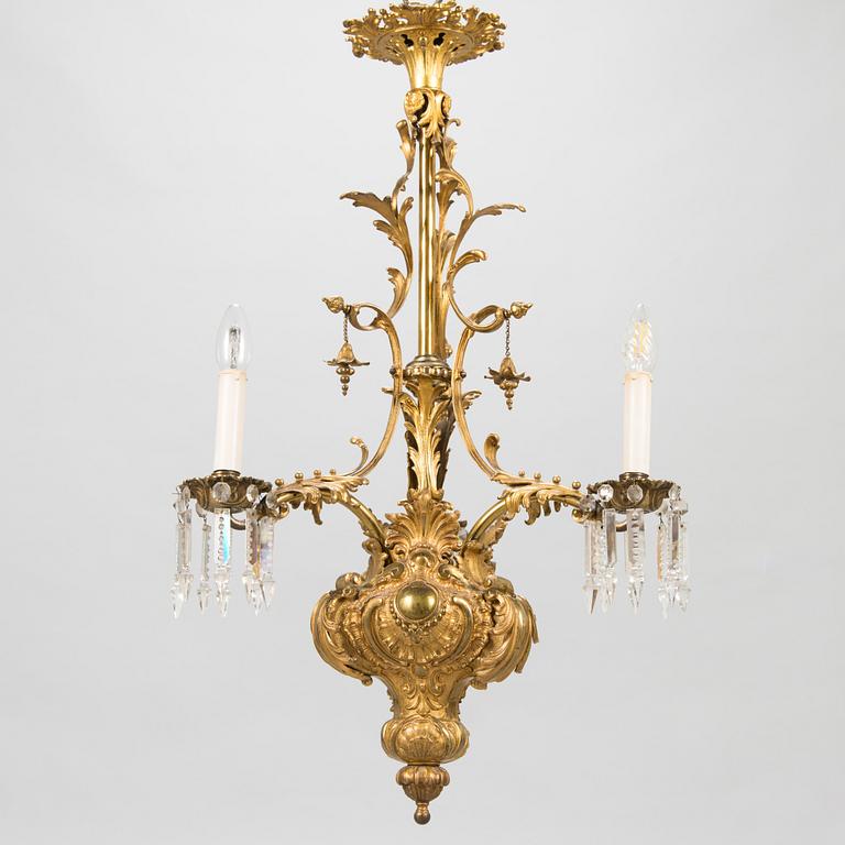 A brass chandelier with prisms, second half of the 19th century. Height 83 cm.
