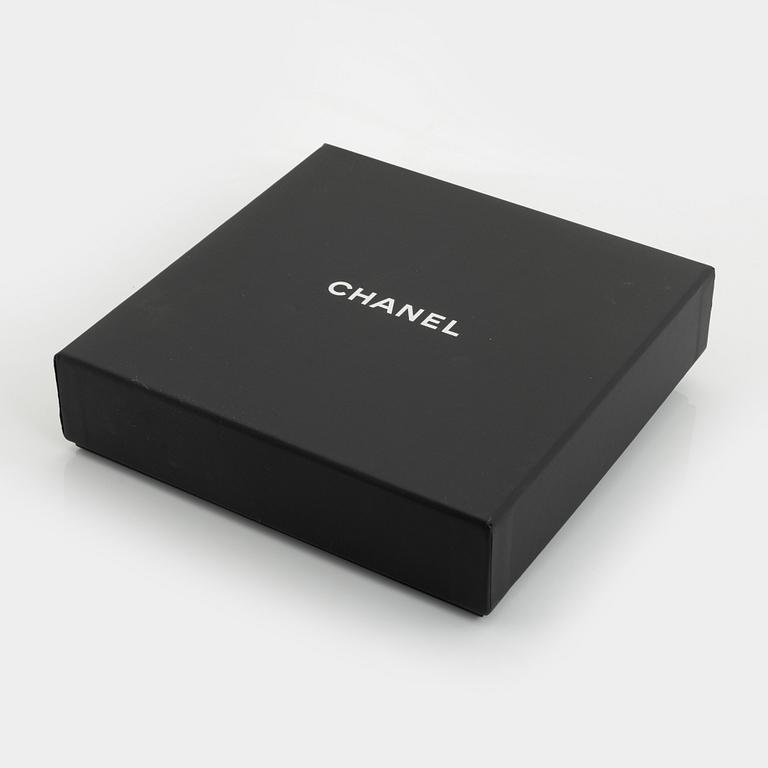 Chanel, a silver tone pearl and leather necklace.