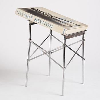 Helmut Newton, Signed book published by Taschen, Monte Carlo, 1999, ed 10000, with a metal table.