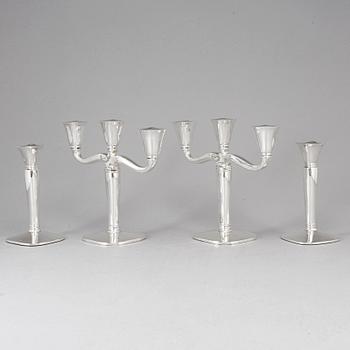 Four (2+2) silver candle holders and candelabras, Germany, 20th century.