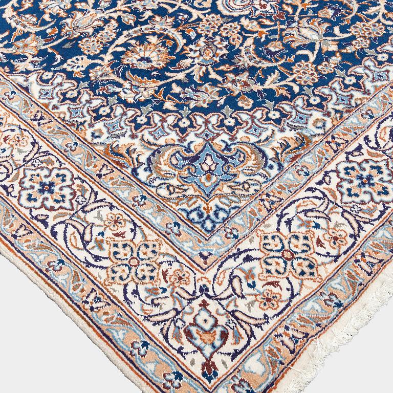 A carpet, Nain, part silk, ca. 295 x 201 cm.