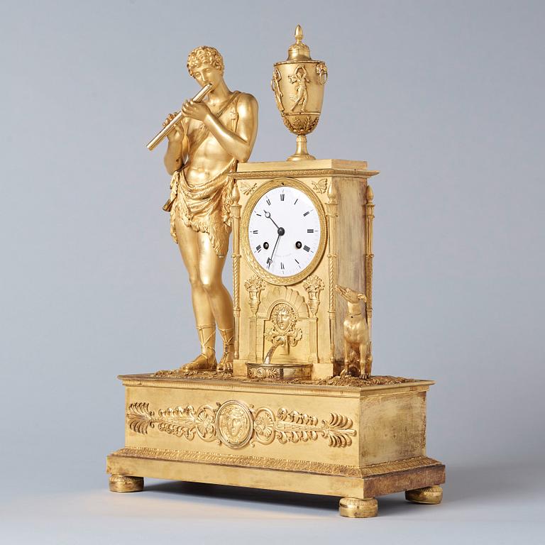 A French Empire early 19th century gilt bronze mantel clock.