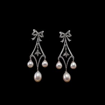 A PAIR OF EARRINGS, brilliant cut diamonds c. 1.83 ct. Cultivated pearls 7 - 8,5 mm. 18K white gold, weight 12,6 g.