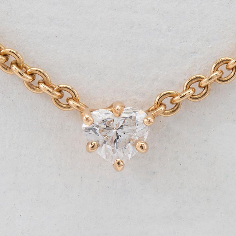 Necklace, 18K gold with heart-shaped diamond.