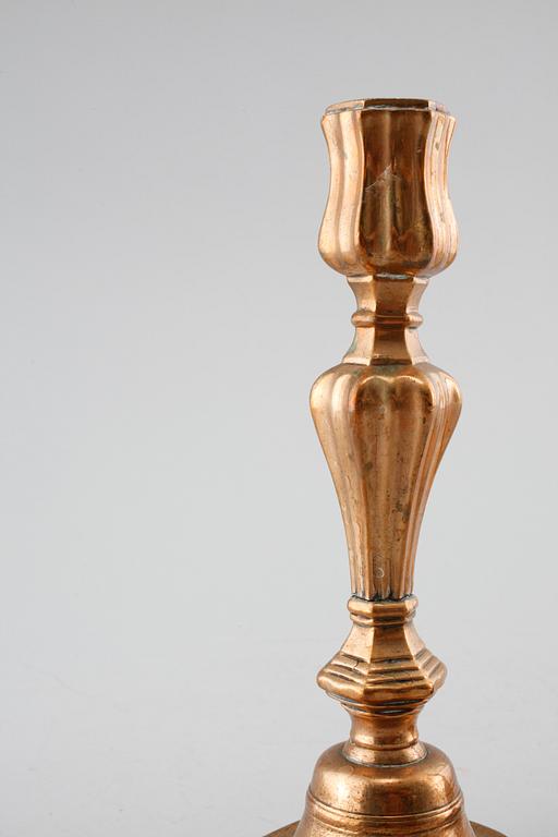 A pair of late barouqe bronze candlesticks, 18th century.