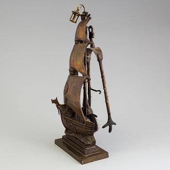 A set of three, early 20th century, bronze fire irons together with a stand, Nestor, England.