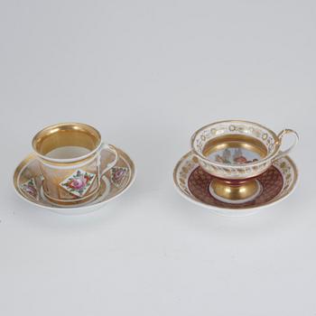 KOPPAR, 2 st, porslin, bl.a. Frankrike 1800-tal.