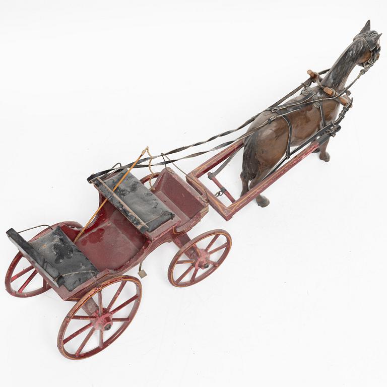 Horse-drawn carriage, early 20th century.