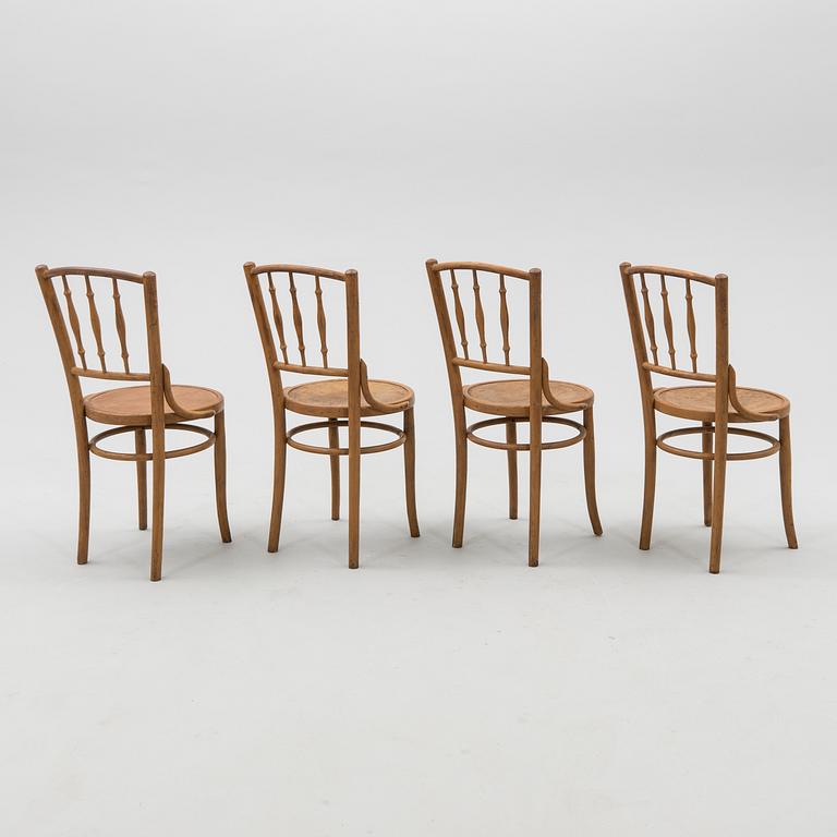 A set of four chairs from the first half of the 20th century.