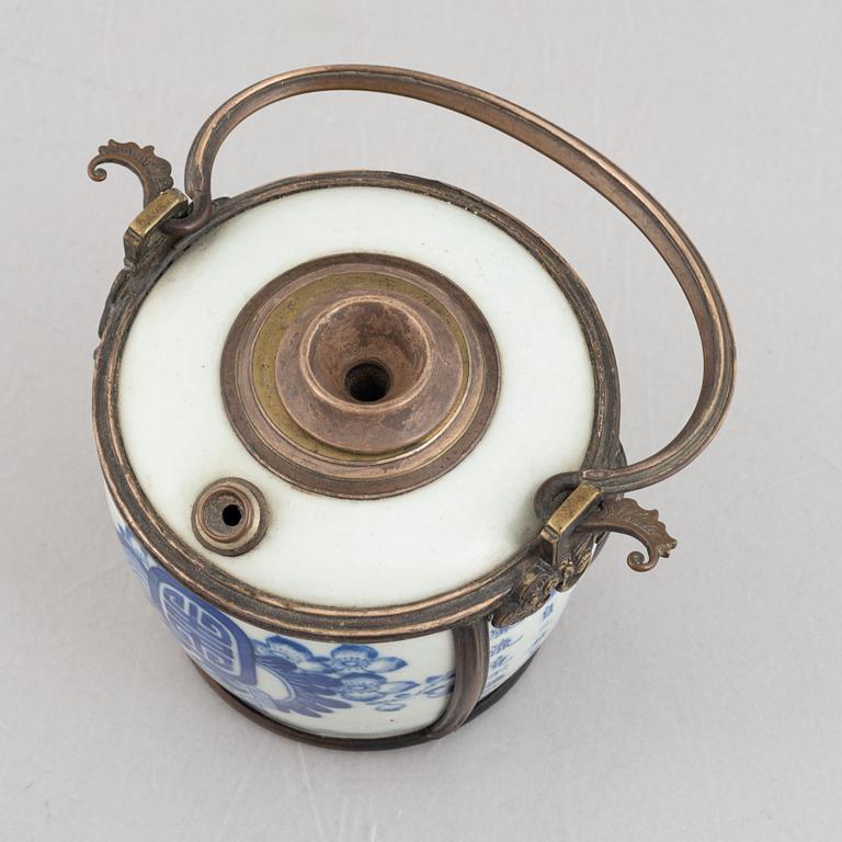 A metal mounted porcelain ewer, late Qing dynasty.