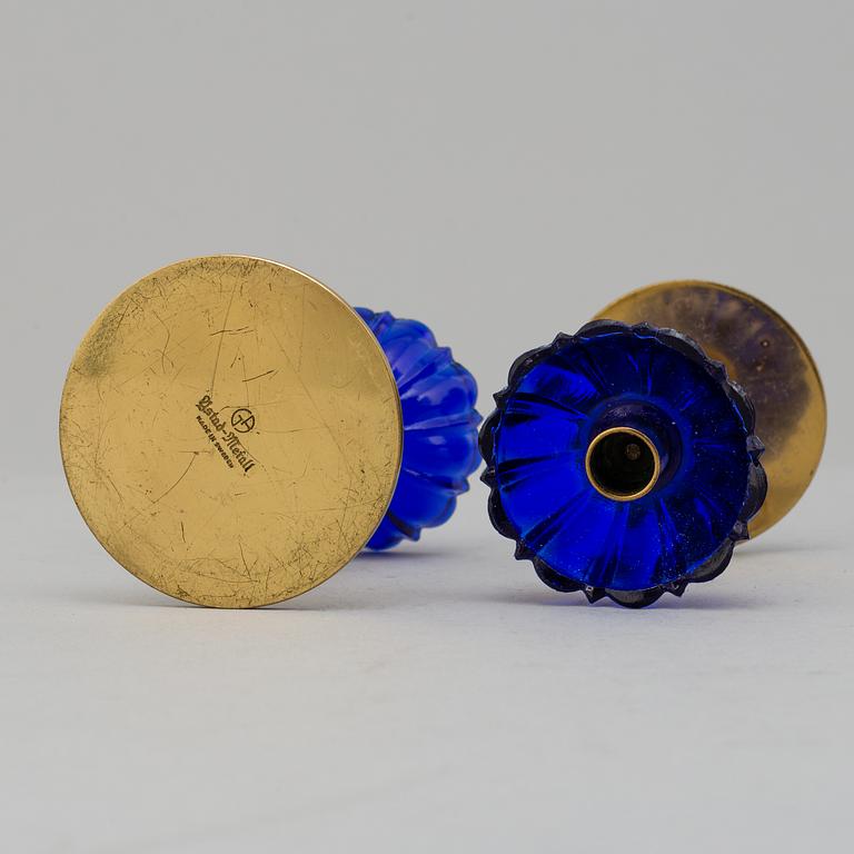 GUNNAR ANDER, 8 brass candlesticks. Ystad Metall, mid 20th century.