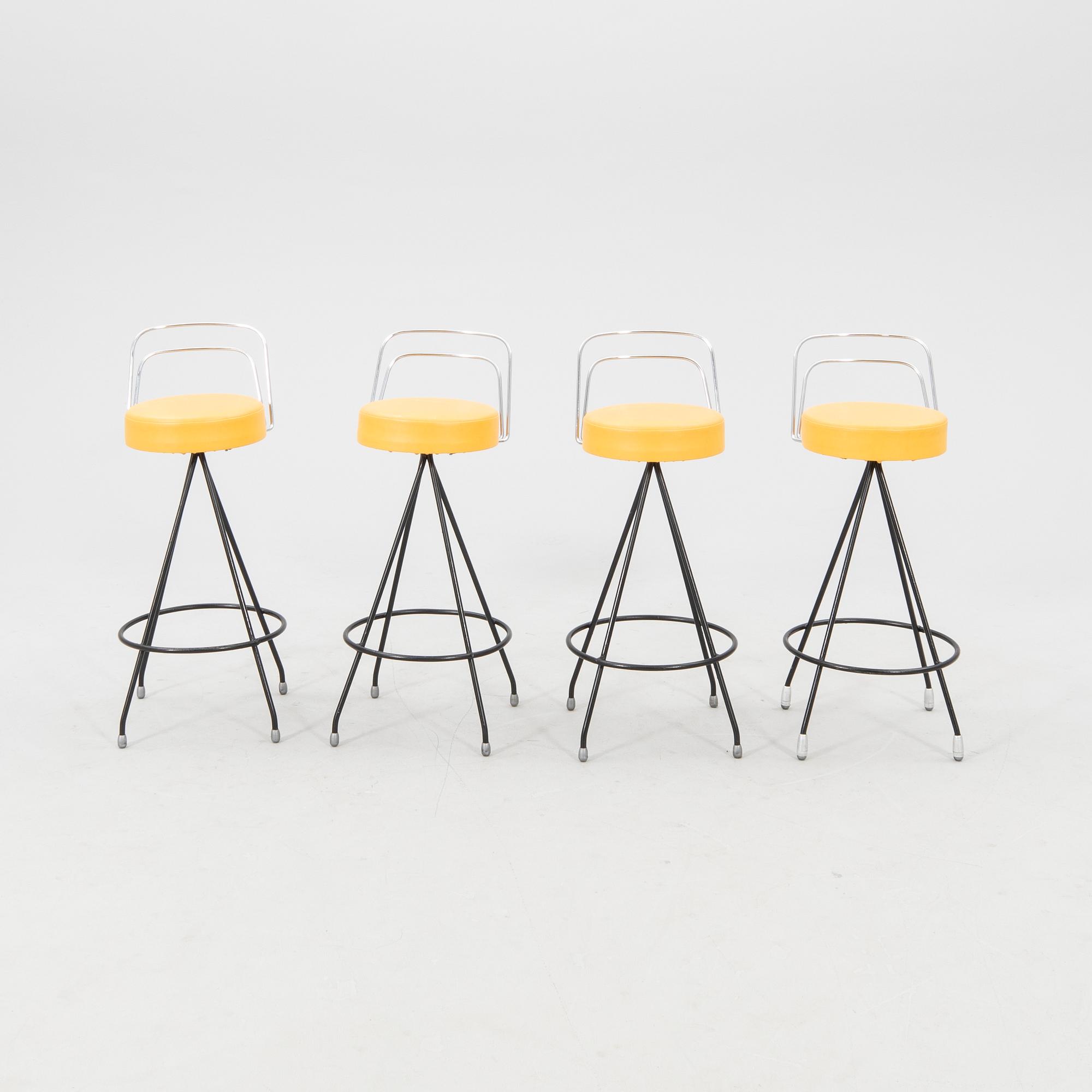 A 1970s bar and four stools.