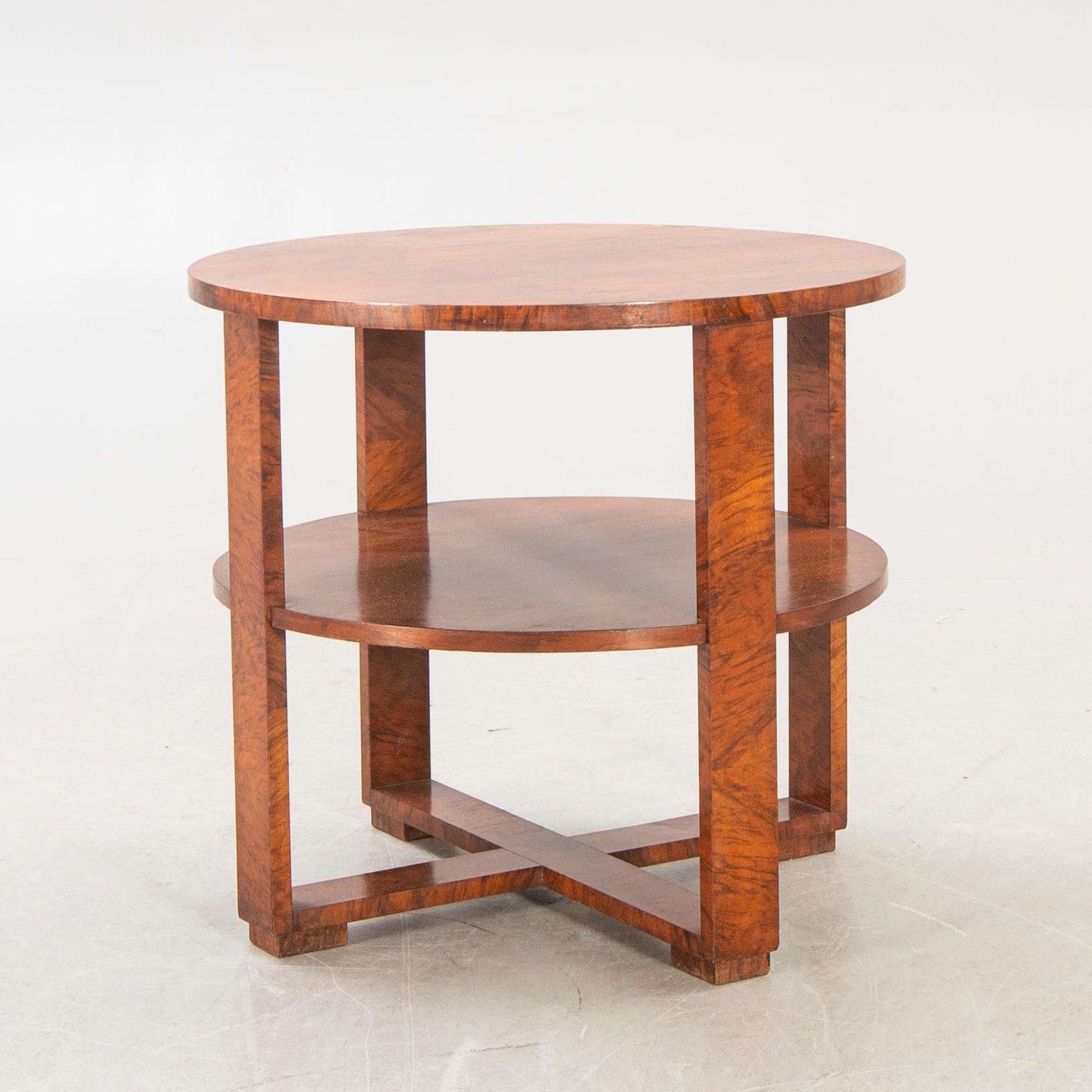 A mid 1900s walnut Art Deco table.