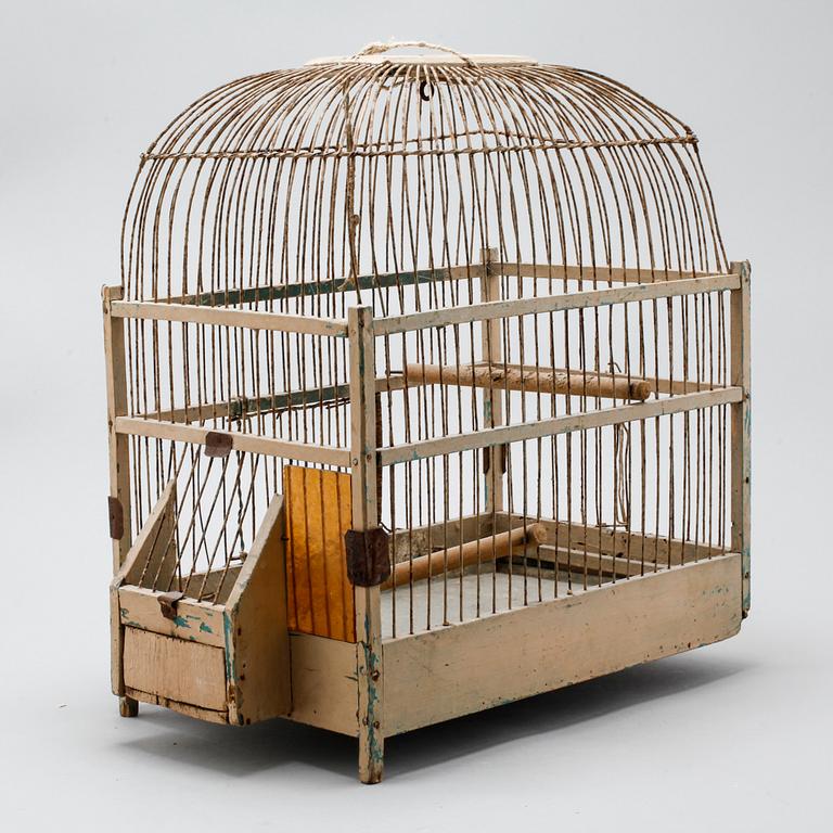 A bird cage from around the year of 1900.