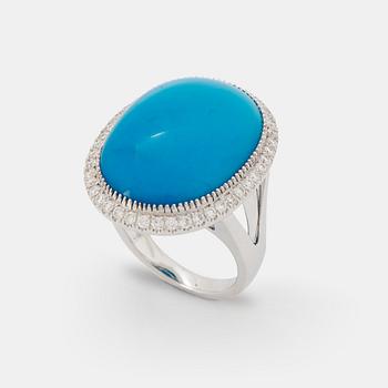 1070. An 18K white gold and turquoise ring set with round brilliant-cut diamonds.