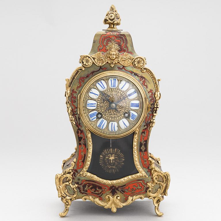 A French boulle style mantel clock, late 19th Century.