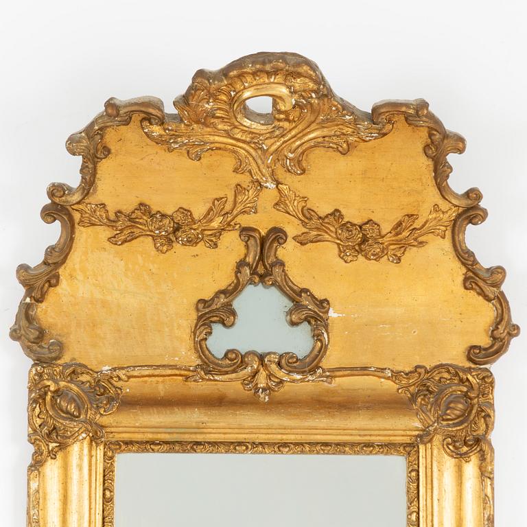 A late 19th Rococo style century mirror.