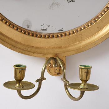A pair of Gustavian giltwood two-branch girandole mirrors by J. Åkerblad (master in Stockholm 1758-99).