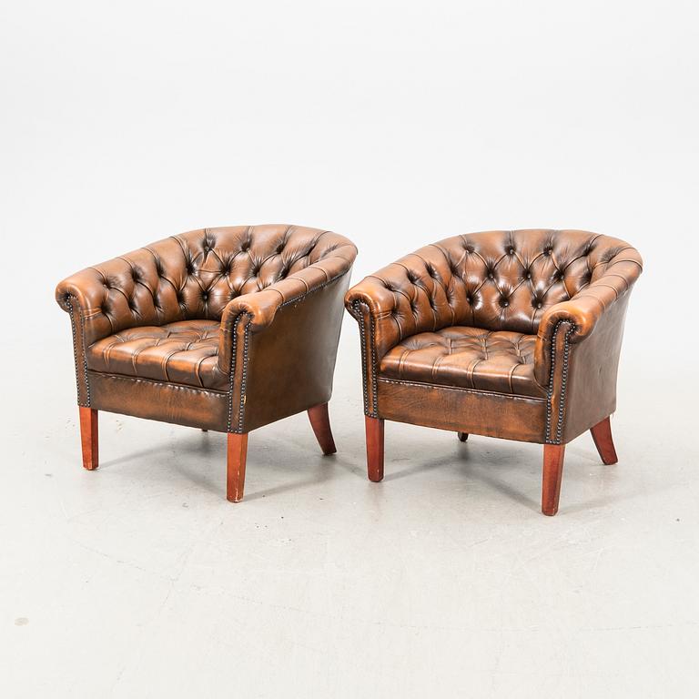 A pair of leather armchairs. second half of the 20th century.