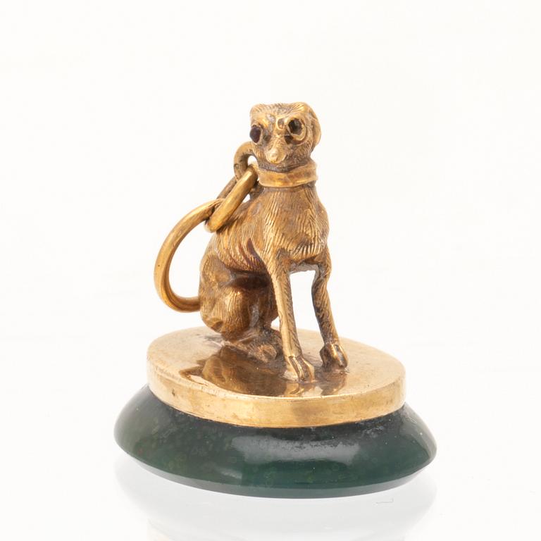 An 18K gold seal/pendant with green stone.
