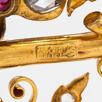 A 14K gold brooch set with rose-cut diamonds and a ruby.
