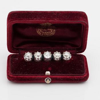 An old-cut diamond brooch set with five diamonds of varying colour. Total carat weight of diamonds circa 8.00cts.