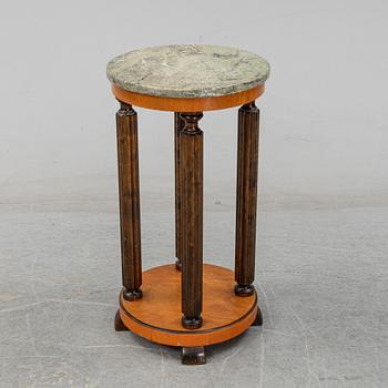 A stone top pedestal, 1920's/30's.