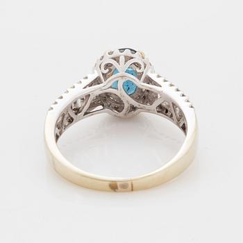 Oval faceted kyanite and diamond ring.