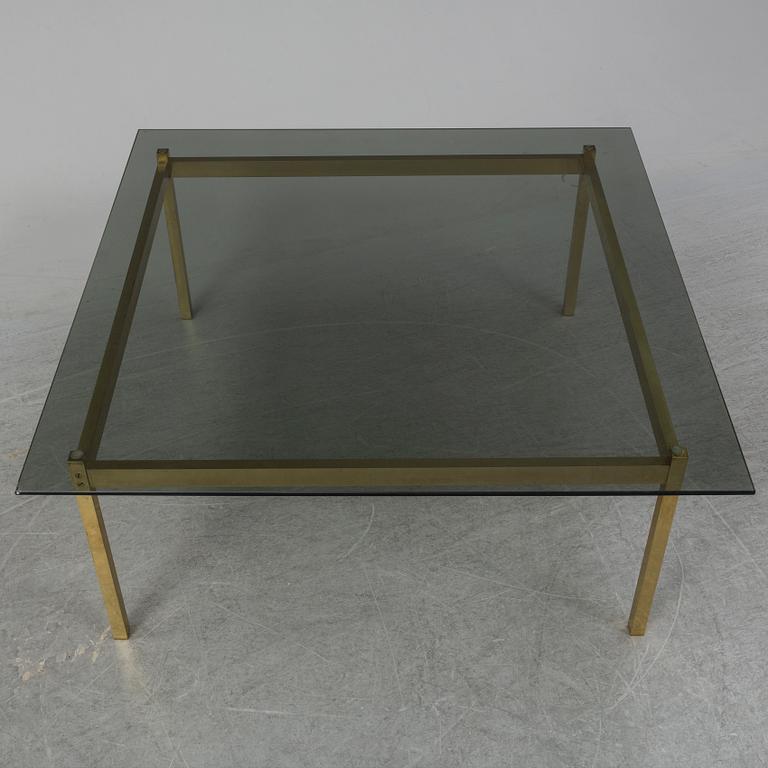 A 1960-70's brass and glass coffee table.