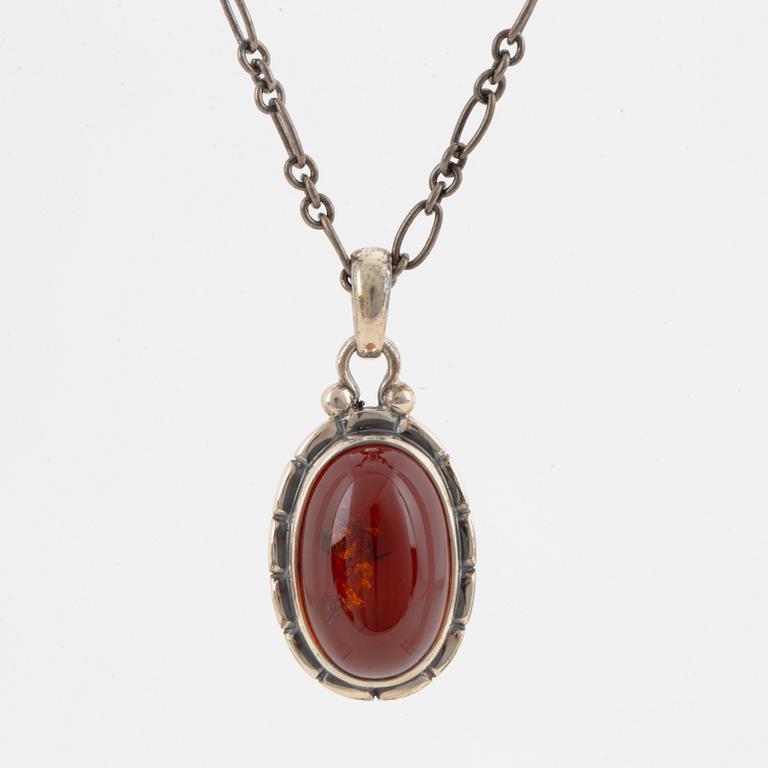 A Georg Jensen silver and cabochon-cut amber necklace.
