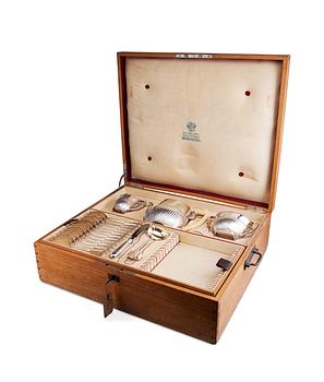 418. CHEST WITH SILVER / A COFFEE SERVICE "OVTCHINNIKOV", 77 PIECES.