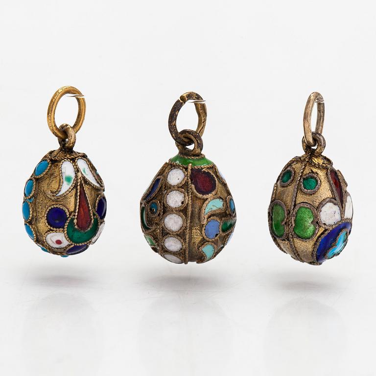 A collection of 24 egg pendants in original wooden box, Russia, early 20th century.