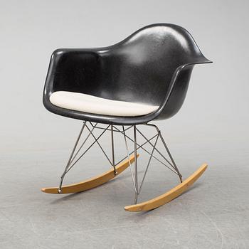A 'Rocket chair' by Charles & Ray Eames, Herman Miller, late 20th century.