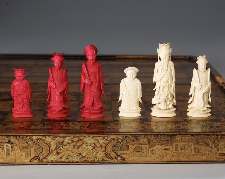 A black lacquer chess game with 32 + 38 ivory and bone figures, late Qing dynasty (1644-1912).