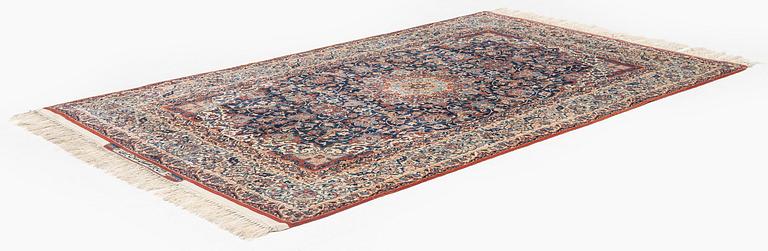 A semi-antique Isfahan rug, signed (Sadegh) Seirafian, c. 244 x 149 cm.