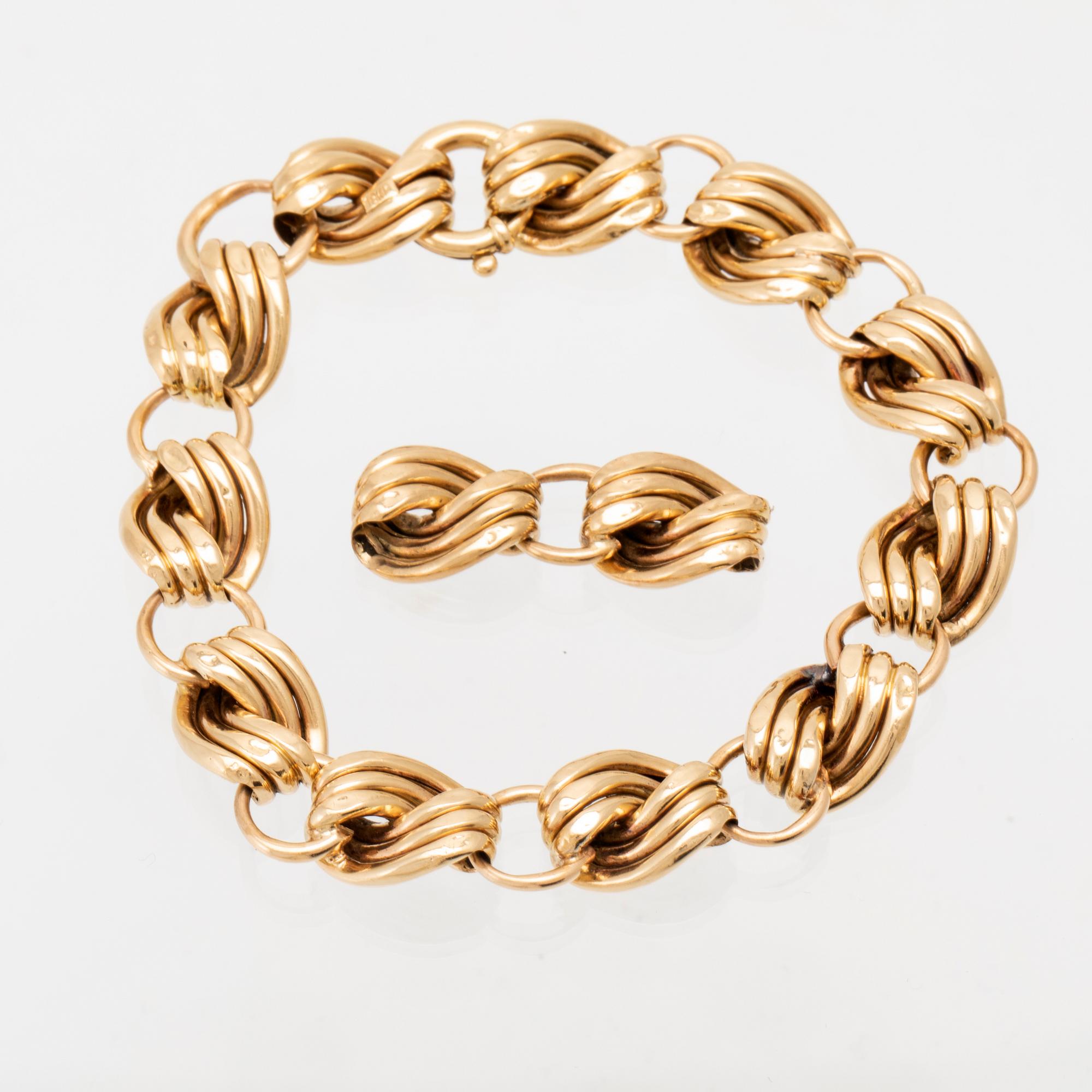 An 18K gold bracelet.