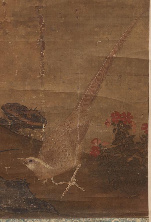 A hanging scroll of birds and magnolia in a garden, Qing dynasty.