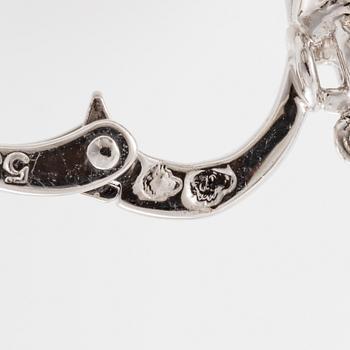 Cartier a pair of earrings platinum set with drop-shaped and round brilliant-cut diamonds.