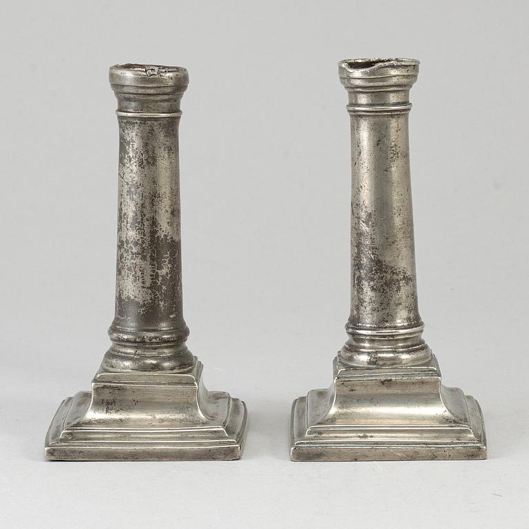A pair of 18th century pewter candlesticks, London.