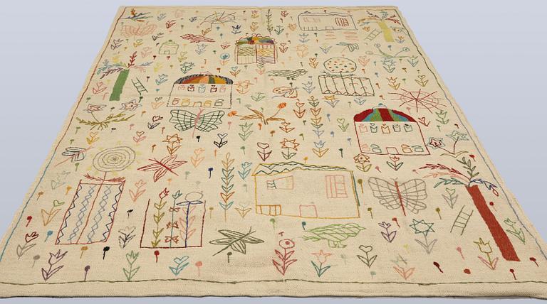 A hand-embroidered Kilim rug, c. 239 x 175 cm.