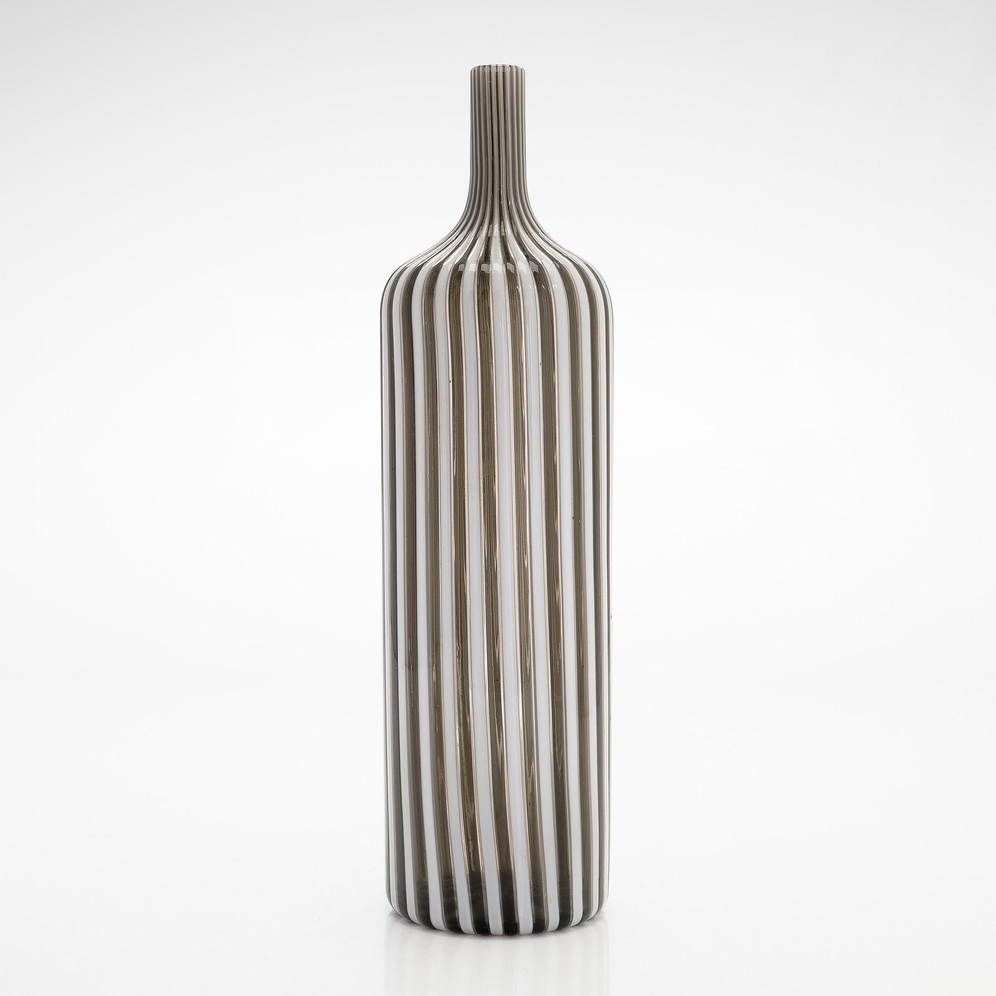 Gio Ponti, a glass bottle '4500' signed Venini, Murano and three drinking glasses, Italy.