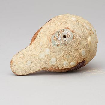 A Tyra Lundgren stoneware figure of a bird, dated 1968.