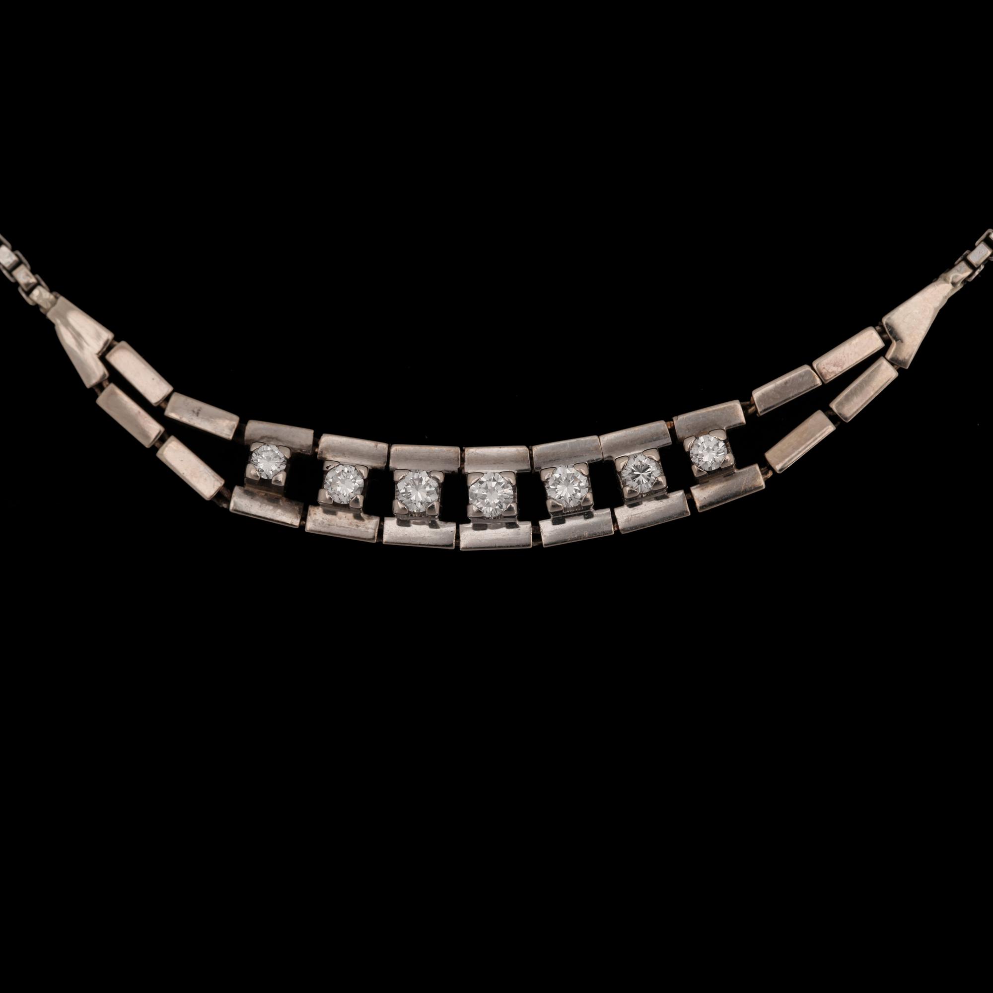 A brilliant cut diamond neclace, tot. app. 0.40 ct.