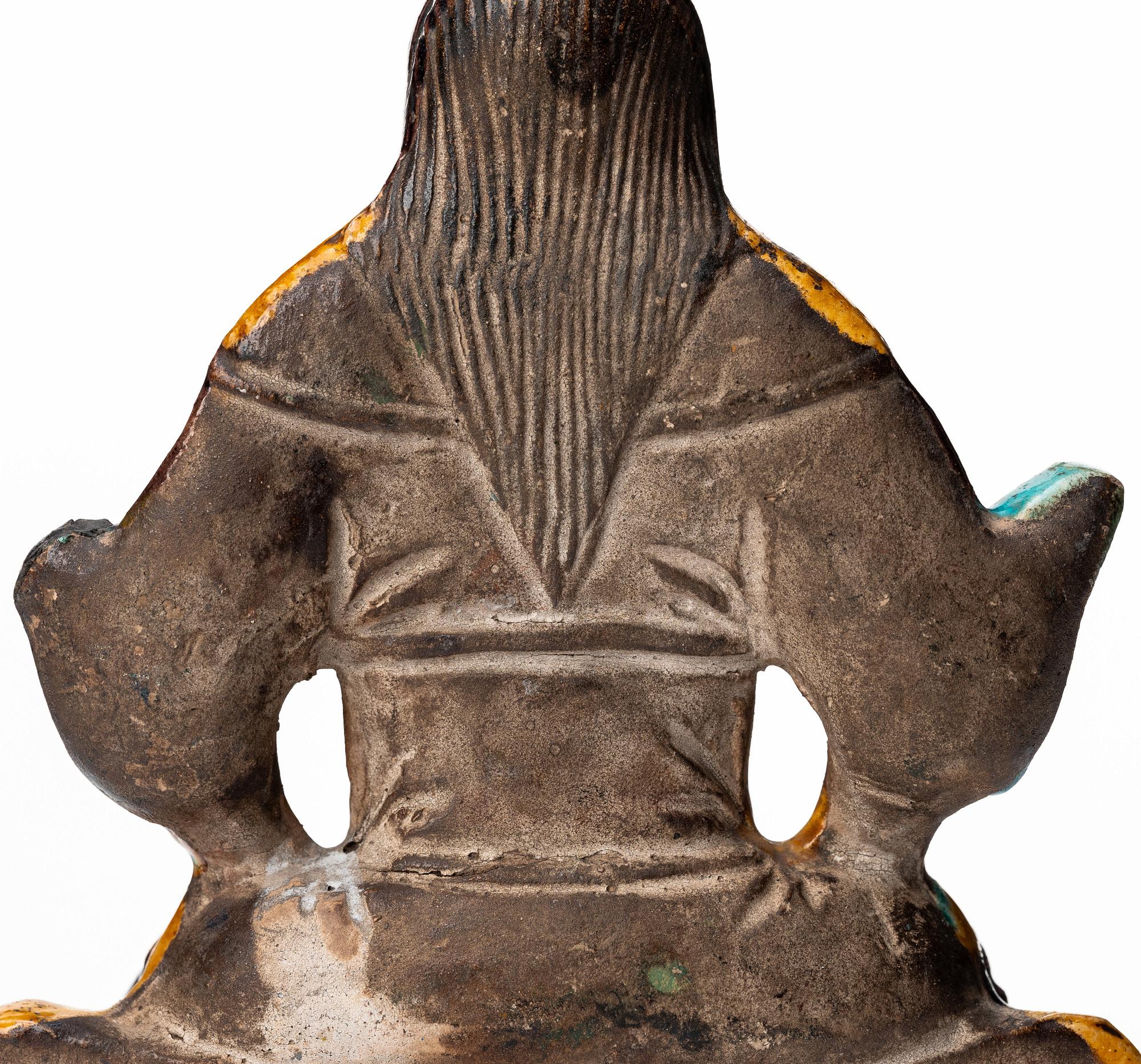A pottery figure of a the warrior god Guandi, Ming dynasty (1368-1644).
