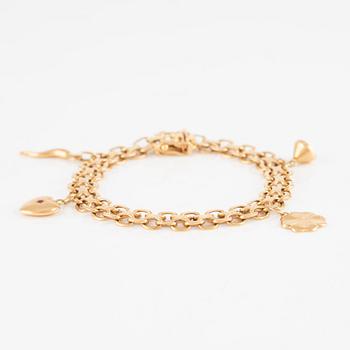 Bracelet 18K gold with charms.