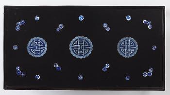 A Chinese black lacquered table with porcelain placques, presumably first half of the 20th century.