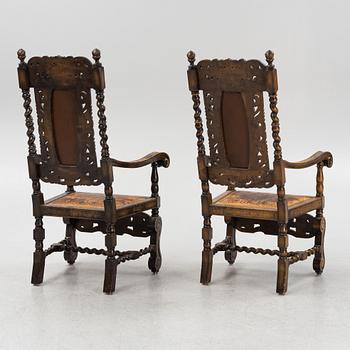 A pair of Baroque style armchairs, first half of the 20th Century.